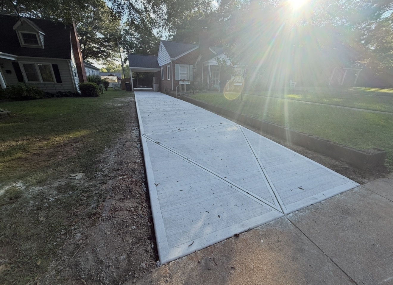 Broom-finish concrete driveway installation in Charlotte, NC